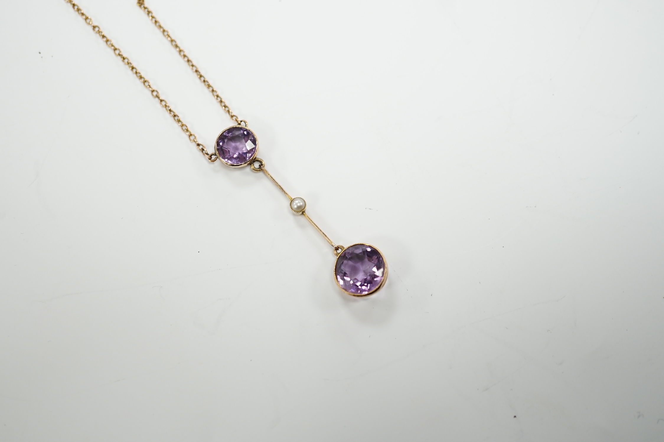 An Edwardian 9ct, two stone amethyst and single stone seed pearl set drop pendant necklace, gross - Image 2 of 9