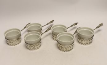 A set of six American sterling mounted handled ceramic soufflé holders, length 17cm.