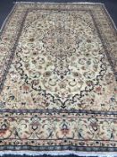 A Kashan ivory ground carpet, 306 x 197cm