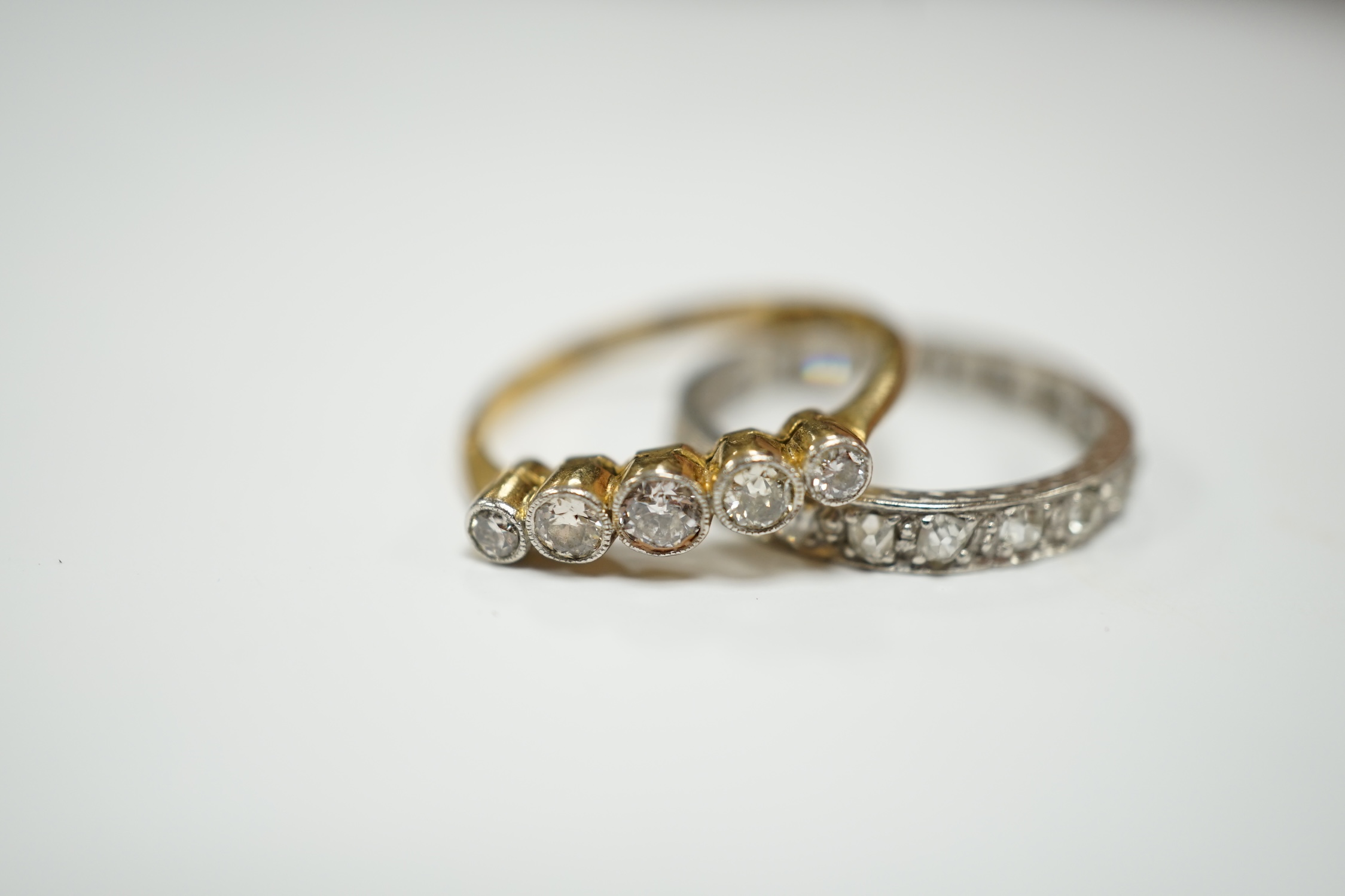 A white metal and diamond chip set full eternity ring and an 18ct and graduated five stone diamond - Image 2 of 7