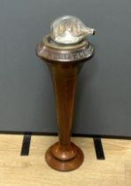 A ship’s compass in a gimbal, believed to be from the tall ship The Archibald Russell, mounted on
