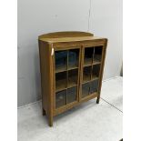 An early 20th century bleached oak glazed bookcase, width 91cm, depth 28cm, height 114cm