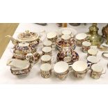 An early 19th century Derby Japan pattern part tea and coffee set, including cups and saucers,