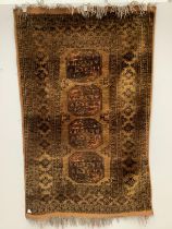 An Afghan gold ground rug, 196 x 125cm