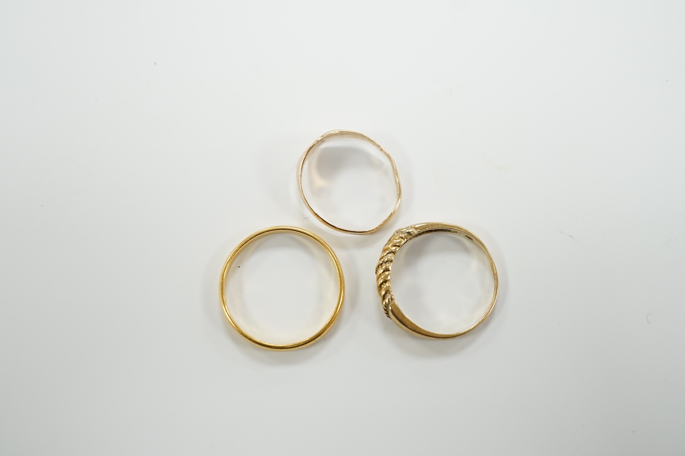 A 22ct gold wedding band, 3.4 grams, a 9ct gold signet ring, 16 grams and a yellow metal ring. - Image 3 of 4