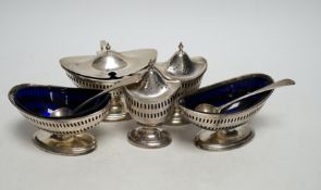 A 1930's George III style five piece silver cruet set, London, 1936/37, with three associated