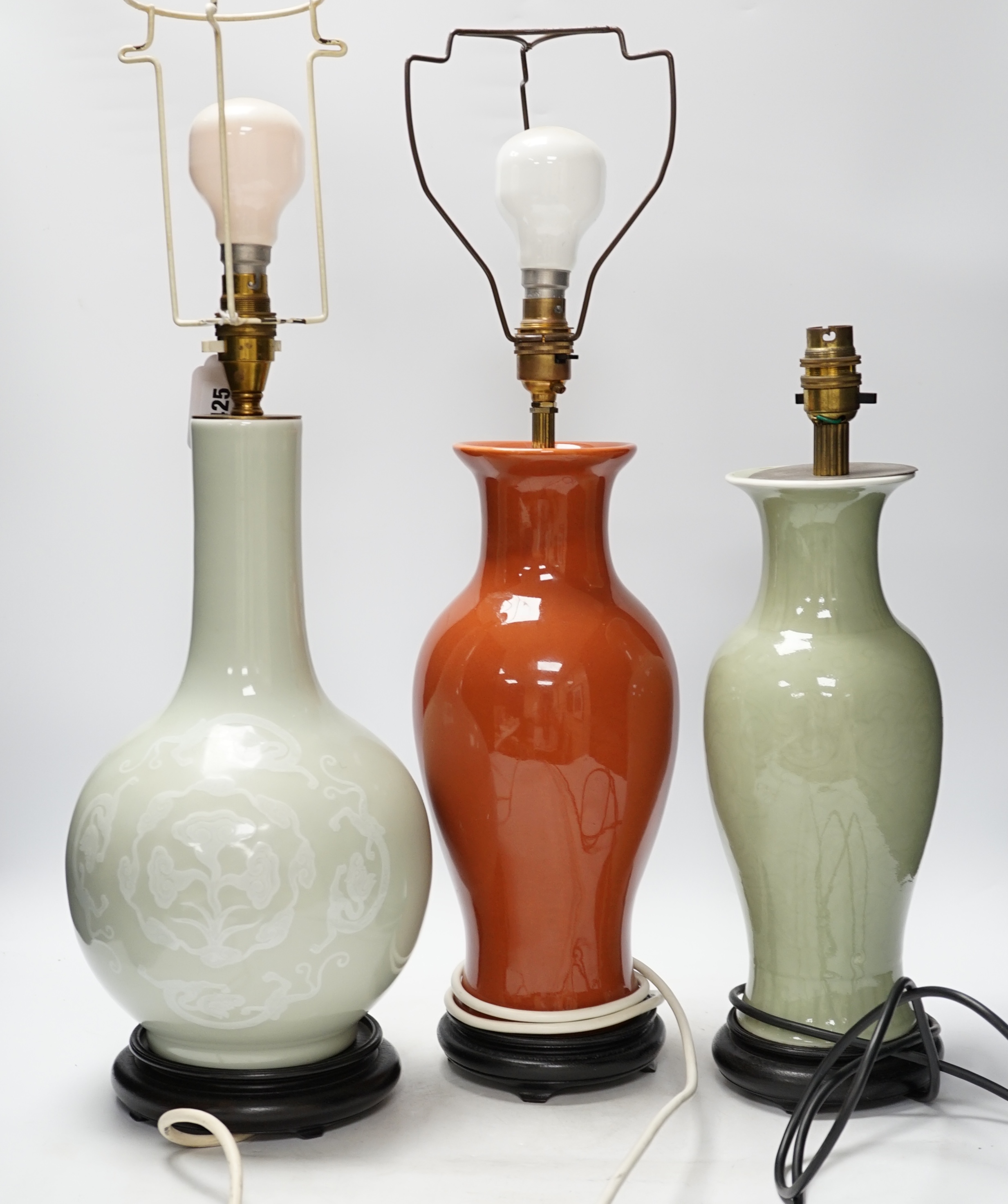 Three Chinese monochrome porcelain lamp bases, 20th century, tallest 38cm high