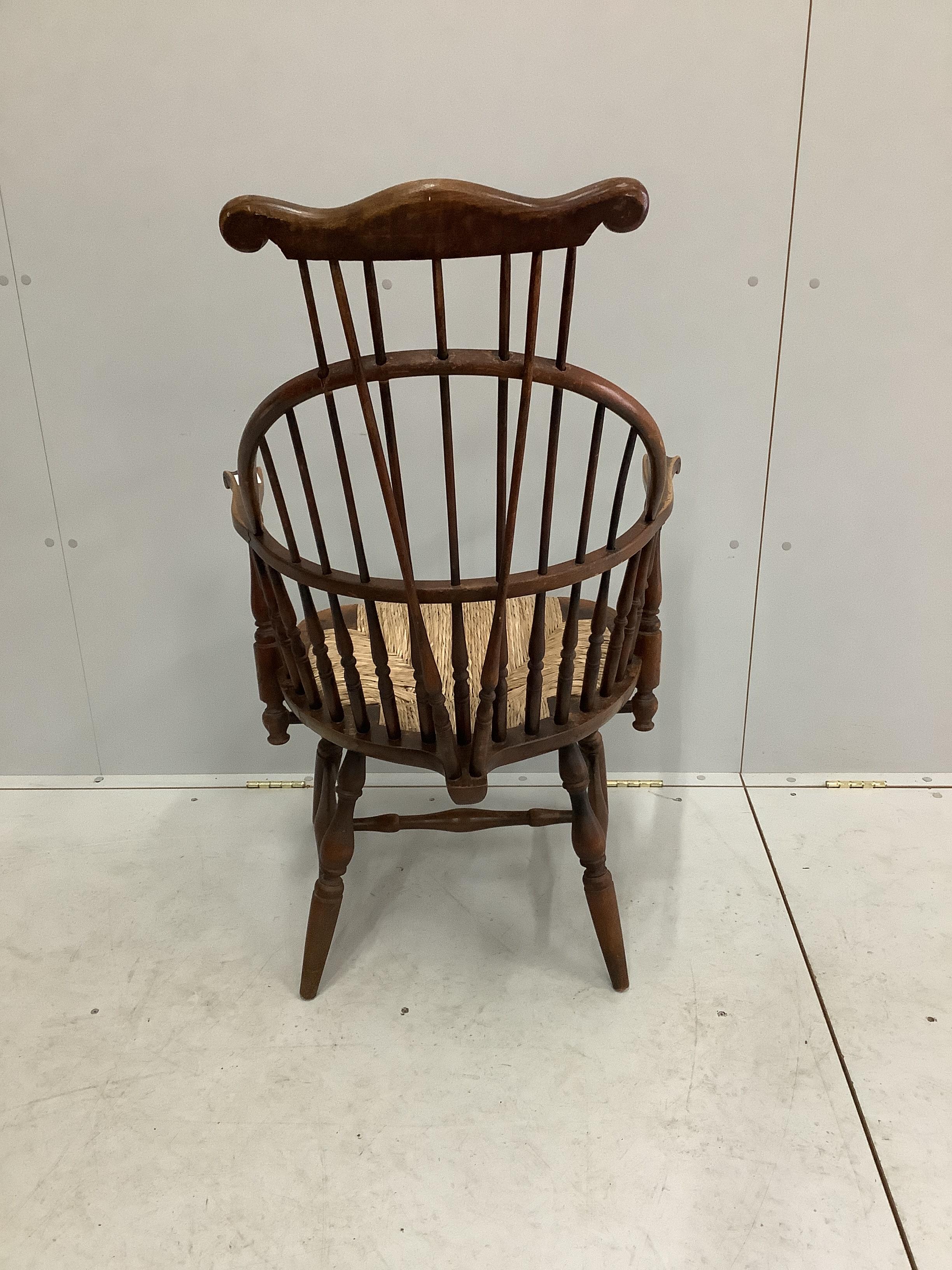 A reproduction American style beech rush seat Windsor comb back armchair, width 64cm, depth 50cm, - Image 2 of 2