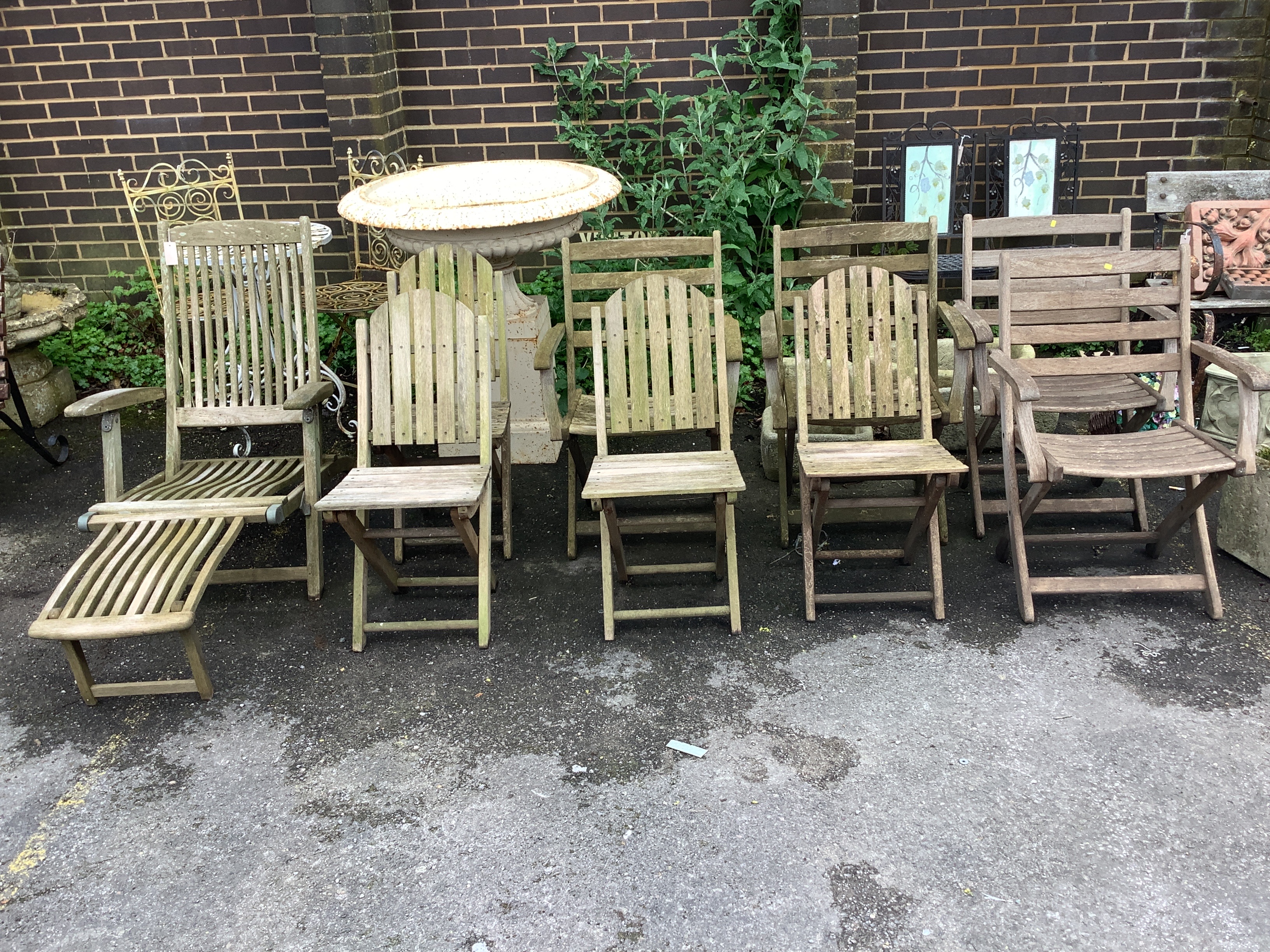 A set of four Alexander Rose teak folding garden elbow chairs, an Alexander Rose teak steamer