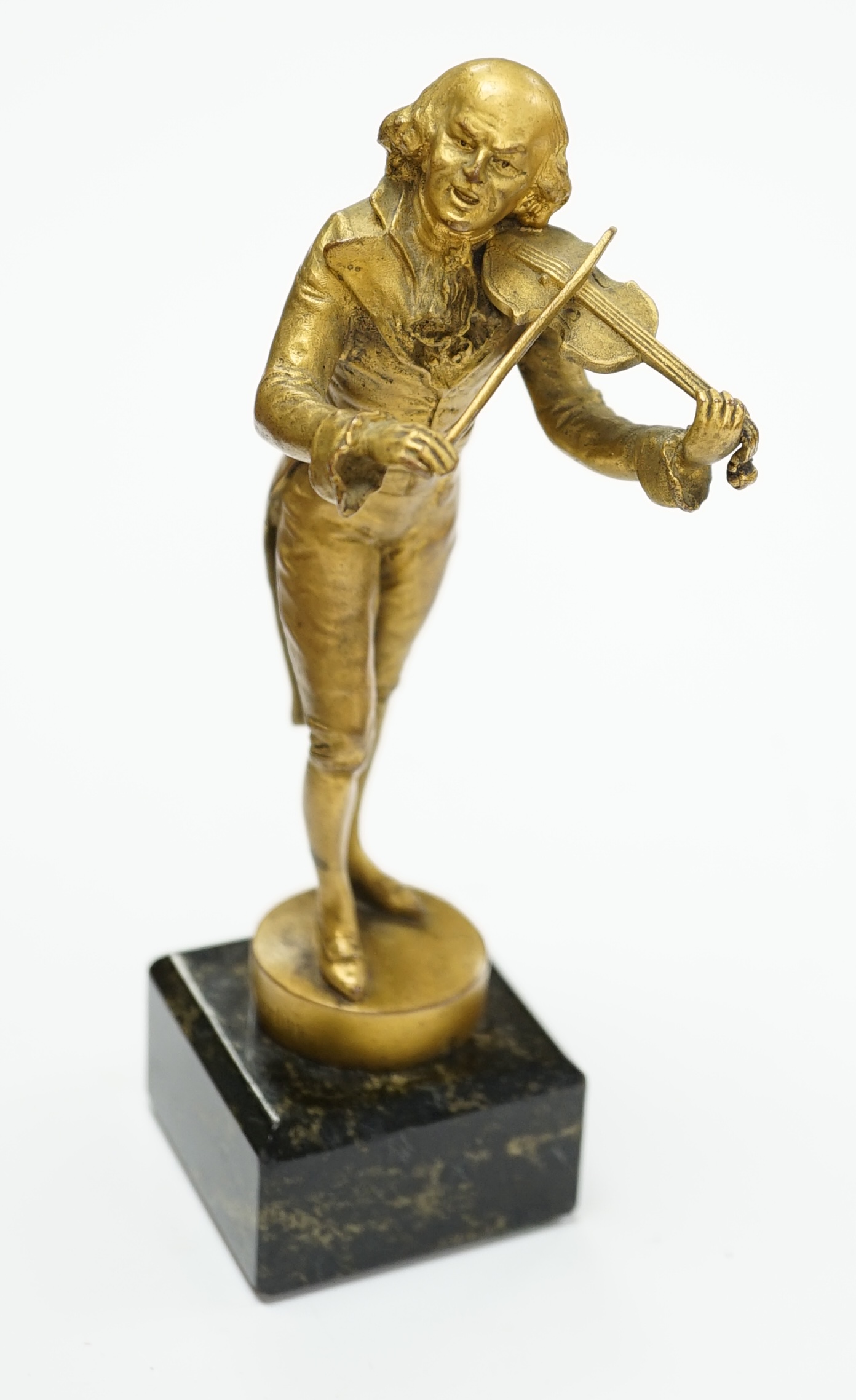 An ormolu bronze of a violinist on a marble base, signed Aktien-Gesellschaft Gladenbeck, Berlin,