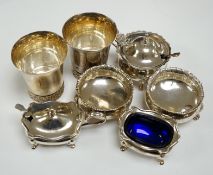 A modern pair of silver tots and five assorted silver condiments.