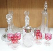 Two pairs of cut glass ships decanters, a square decanter, a ewer and a tall Scottish decanter and