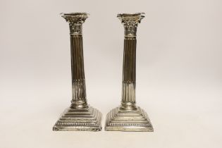 A pair of Edwardian silver Corinthian column candlesticks, by Jones & Crompton, Birmingham, 1903,