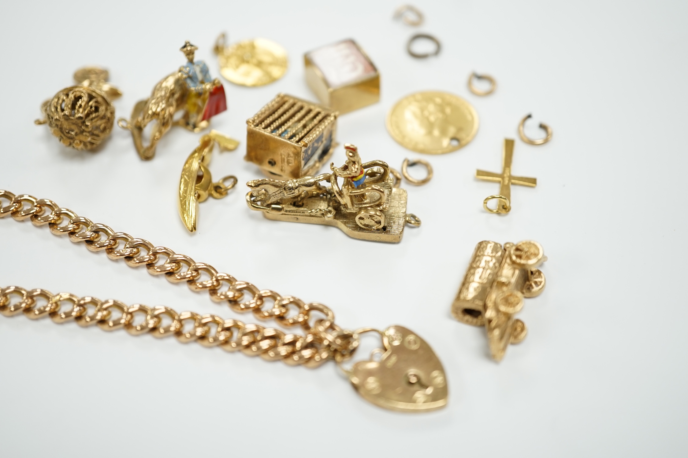 A 9ct gold curb link bracelet and eleven assorted mainly 9ct gold loose charms, gross weight 56.3 - Image 9 of 9