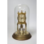 A 20th century German brass torsion pendulum clock under brass dome, 32cm high