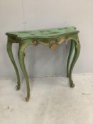 An early 20th century chinoiserie lacquer and green painted serpentine console table, width 93cm,