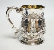 A George II silver pint mug, by John Broughton?, London, 1746, with later embossed decoration and