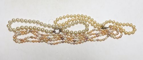 Three assorted single strand cultured South Sea pearl necklaces, largest 136cm.