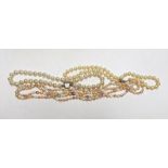 Three assorted single strand cultured South Sea pearl necklaces, largest 136cm.