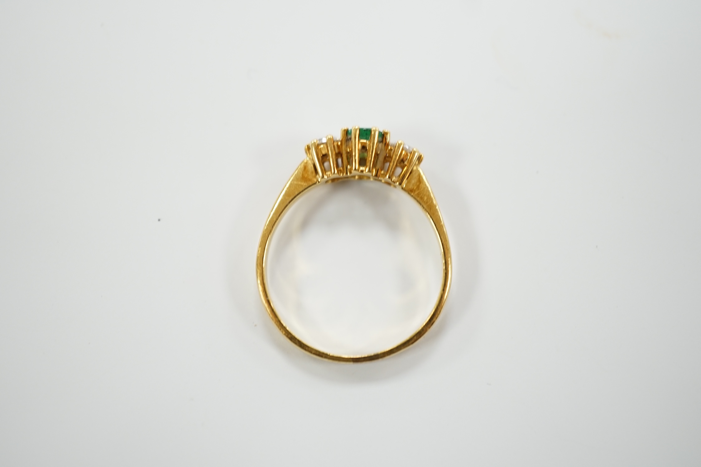 A modern 18ct gold, emerald and diamond set three stone ring, size P, gross weight 3.2 grams. - Image 4 of 5