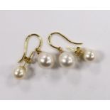 A pair of 18ct gold and cultured pearl and diamond chip set drop earrings and a pair of 18k and