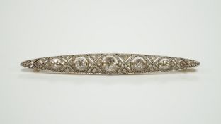A Belle Epoque yellow and white metal mounted diamond cluster set navette shaped bar brooch, 69mm,