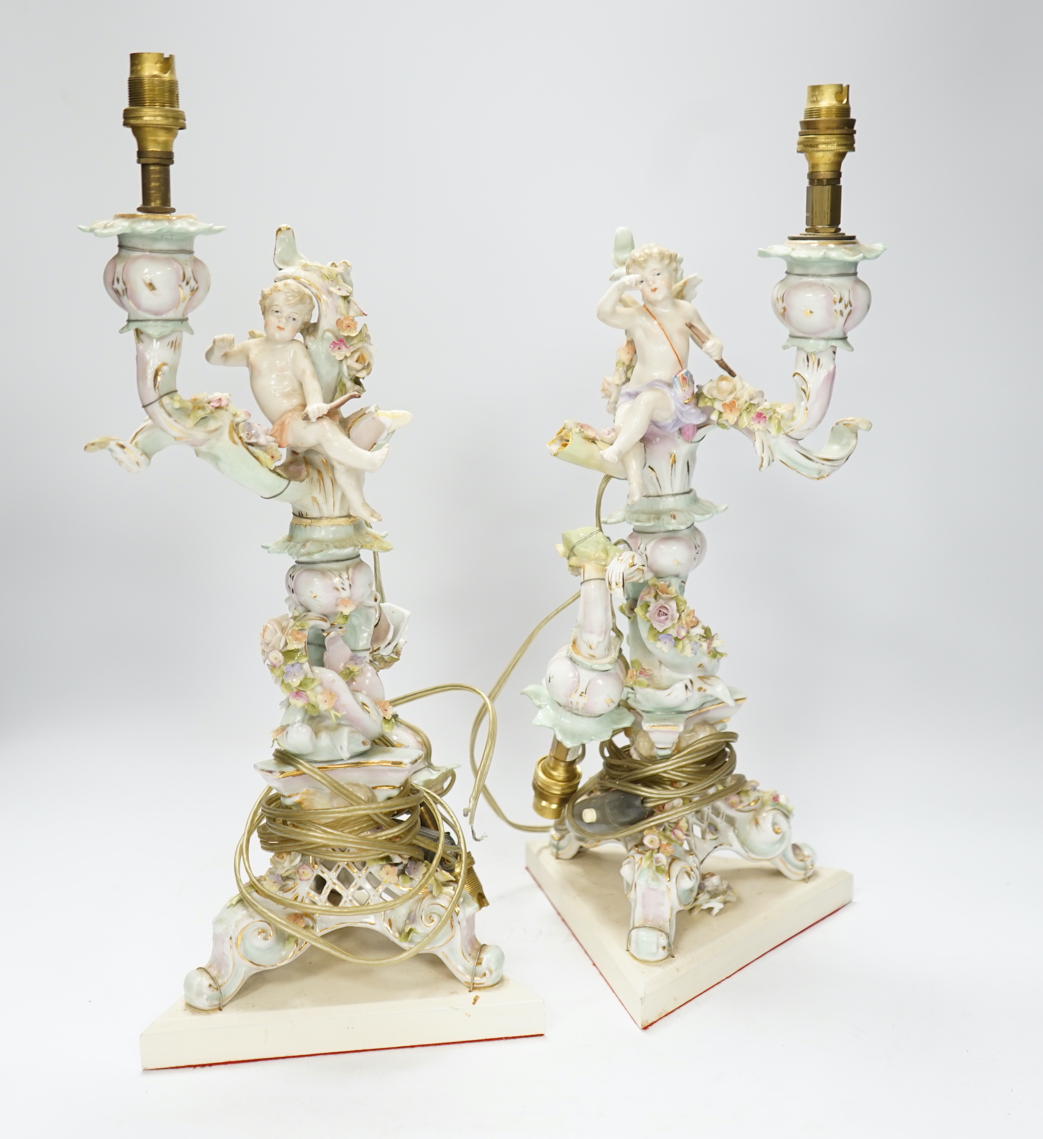 A pair of Sitzendorf floral encrusted porcelain table lamps, 42cm total