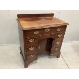 A George III and later mahogany kneehole desk with secretaire drawer, width 85cm, depth 52cm, height