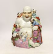 A Chinese enamelled porcelain group of laughing Budai with children, mid 20th century, 31cm high