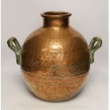 A copper vessel with double brass handles, 39cm high