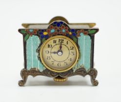 A miniature enamel timepiece modelled as a mantle clock, with watch movement, 2cm high, in fitted