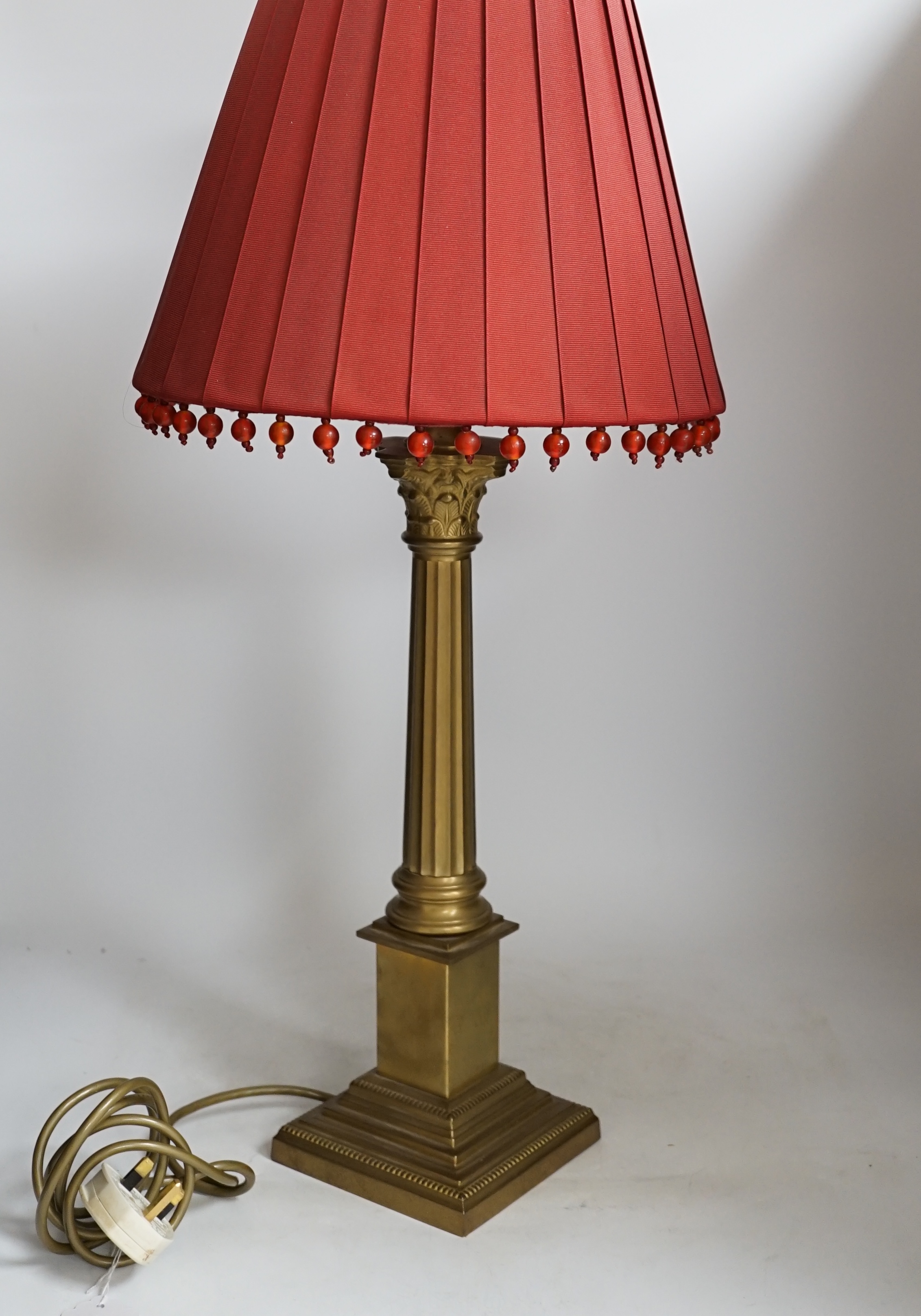 A brass column table lamp, 65cm high