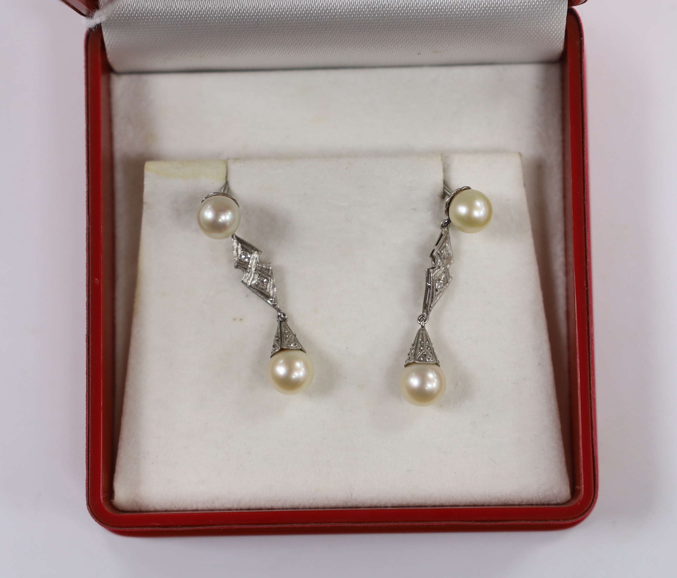 A pair of white metal, two stone cultured pearl and two stone diamond chip set drop earrings, - Image 2 of 2