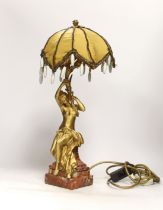 D. Gasq, a gilt bronze figural lamp on a red marble stepped base, 47cm high