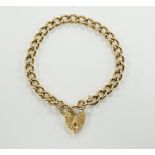 A 9ct gold curb link bracelet with 9ct padlock, 18cm, 22.5g.