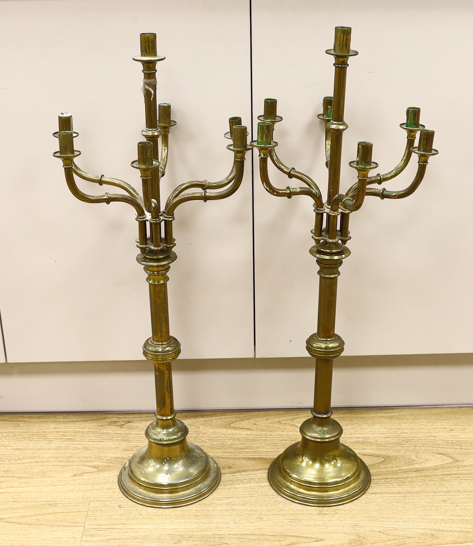 A pair of French brass altar six branch candelabra, 82cm high