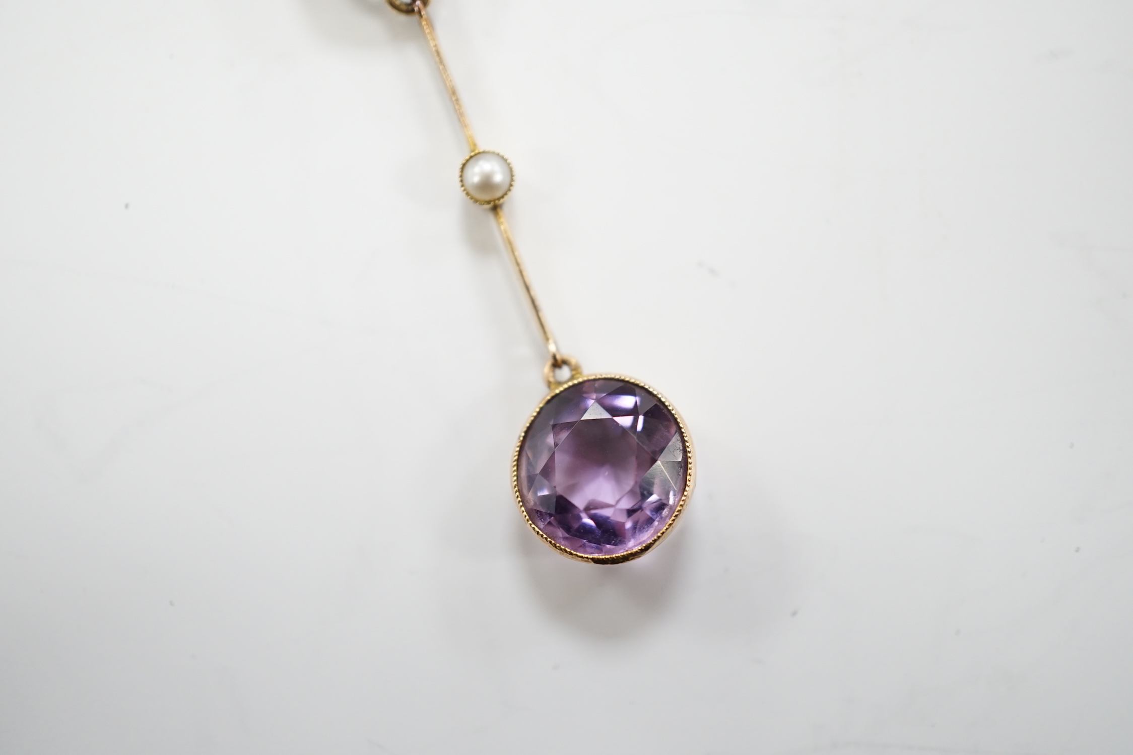 An Edwardian 9ct, two stone amethyst and single stone seed pearl set drop pendant necklace, gross - Image 8 of 9