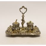 A 19th century Austrian embossed gilt white metal and multi gem set rectangular inkstand, with