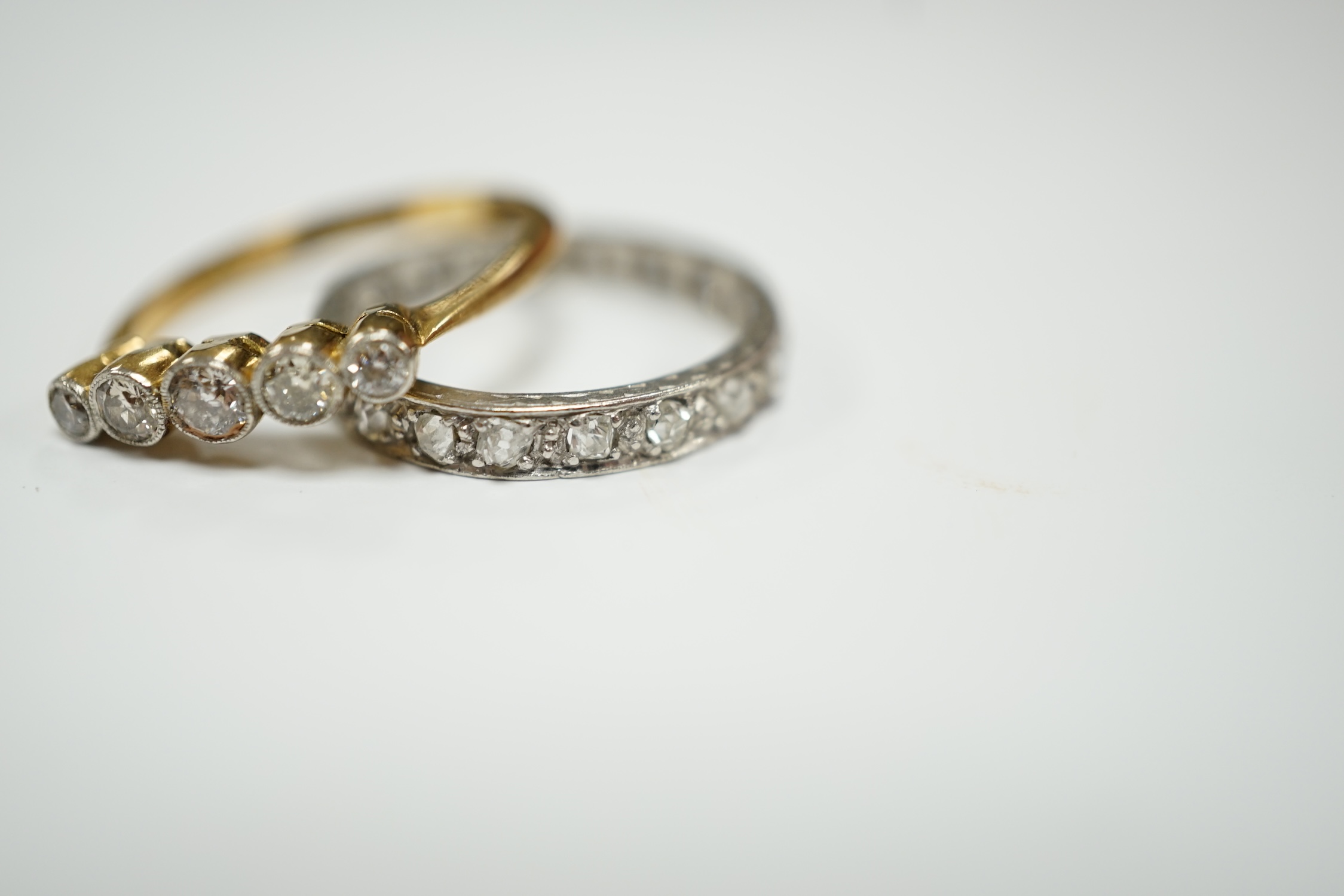 A white metal and diamond chip set full eternity ring and an 18ct and graduated five stone diamond - Image 3 of 7