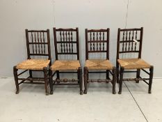 A harlequin set of four Lancashire rush seat spindle back dining chairs