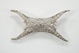 A 1920's white metal and millegrain set diamond cluster set brooch, 46mm, gross weight 5.2 grams.