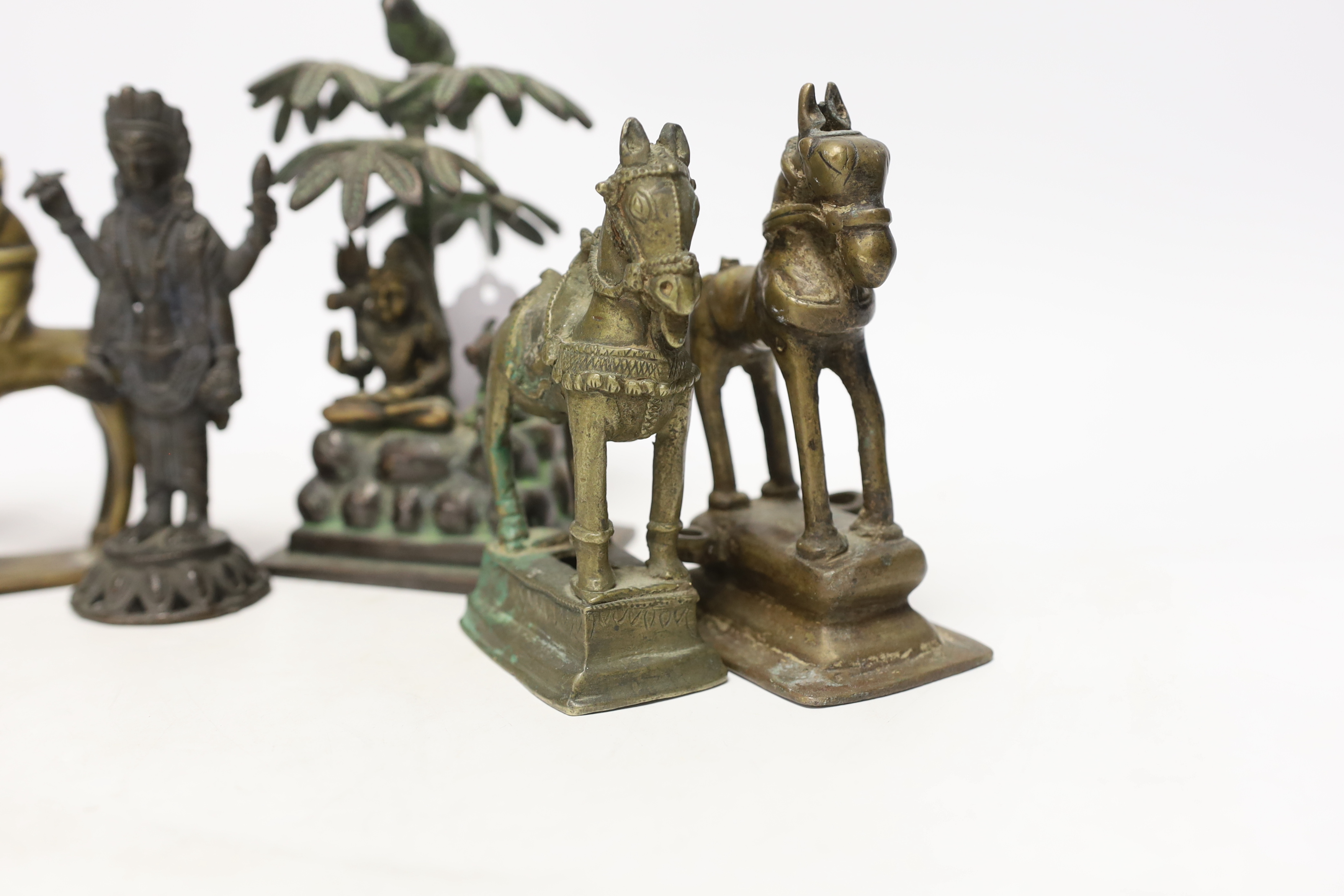 Six Indian bronze/brass ornaments; Shiva sitting under a bael tree with a bird, 17cm, two figures of - Image 3 of 5