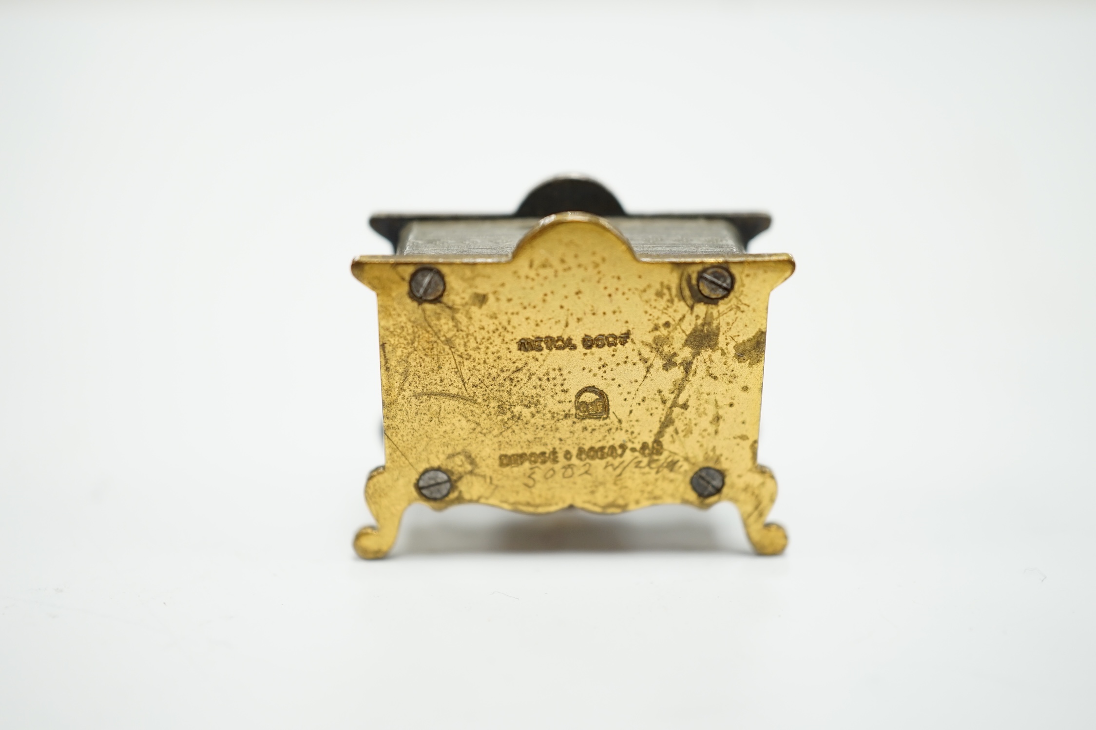 A miniature enamel timepiece modelled as a mantle clock, with watch movement, 2cm high, in fitted - Image 4 of 5