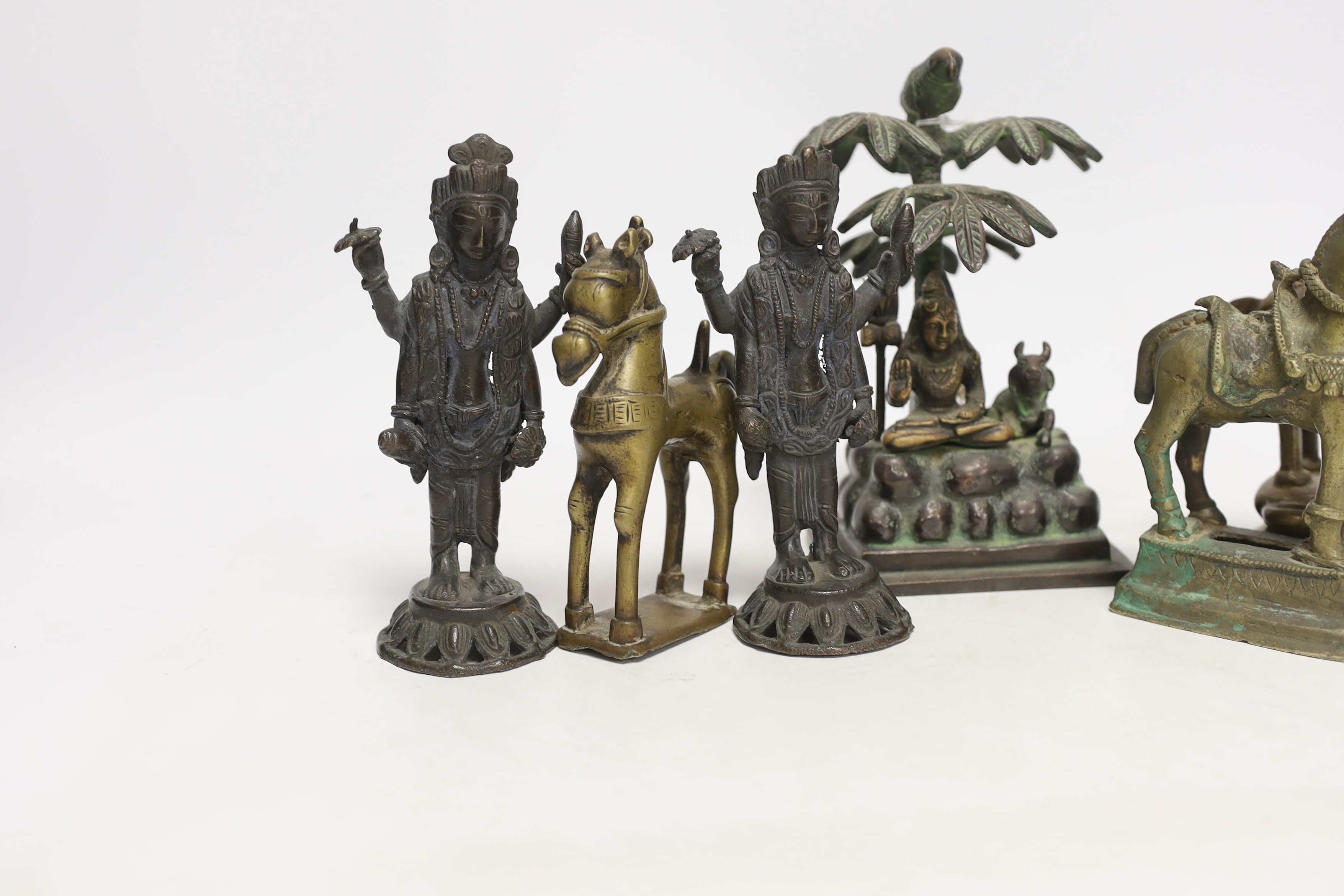 Six Indian bronze/brass ornaments; Shiva sitting under a bael tree with a bird, 17cm, two figures of - Image 2 of 5