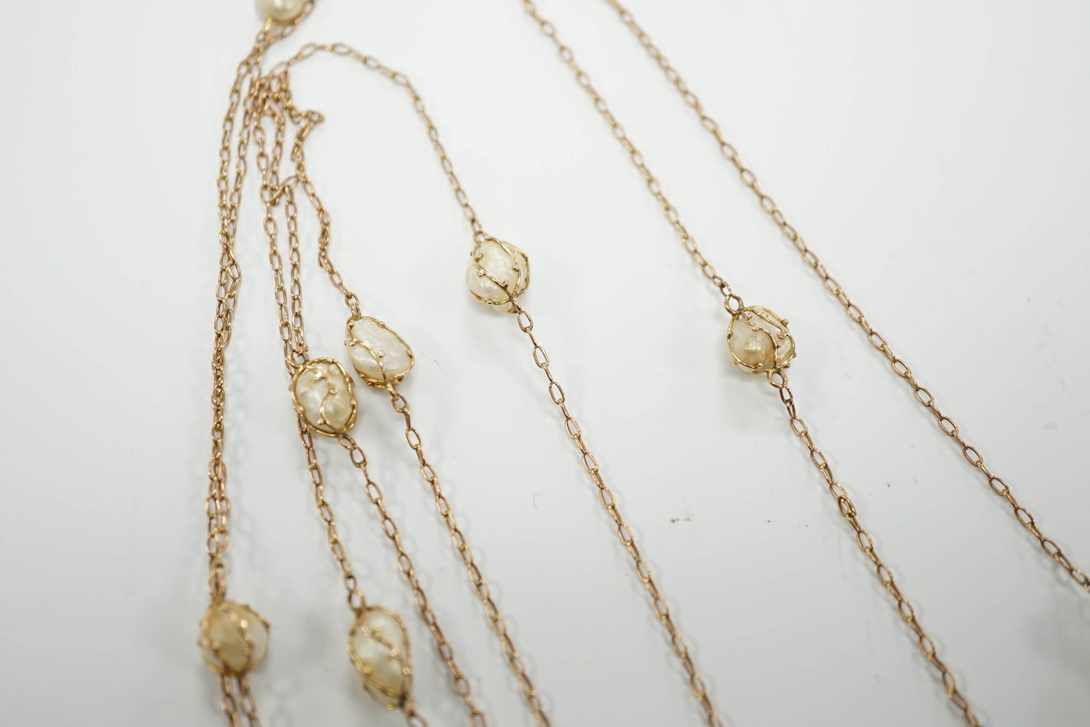 An early 20th century 9ct and eleven stone baroque pearl set long chain, 160cm, gross 13.2 grams. - Image 3 of 5
