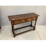 An early 18th century style oak two drawer side table, width 107cm, depth 36cm, height 72cm