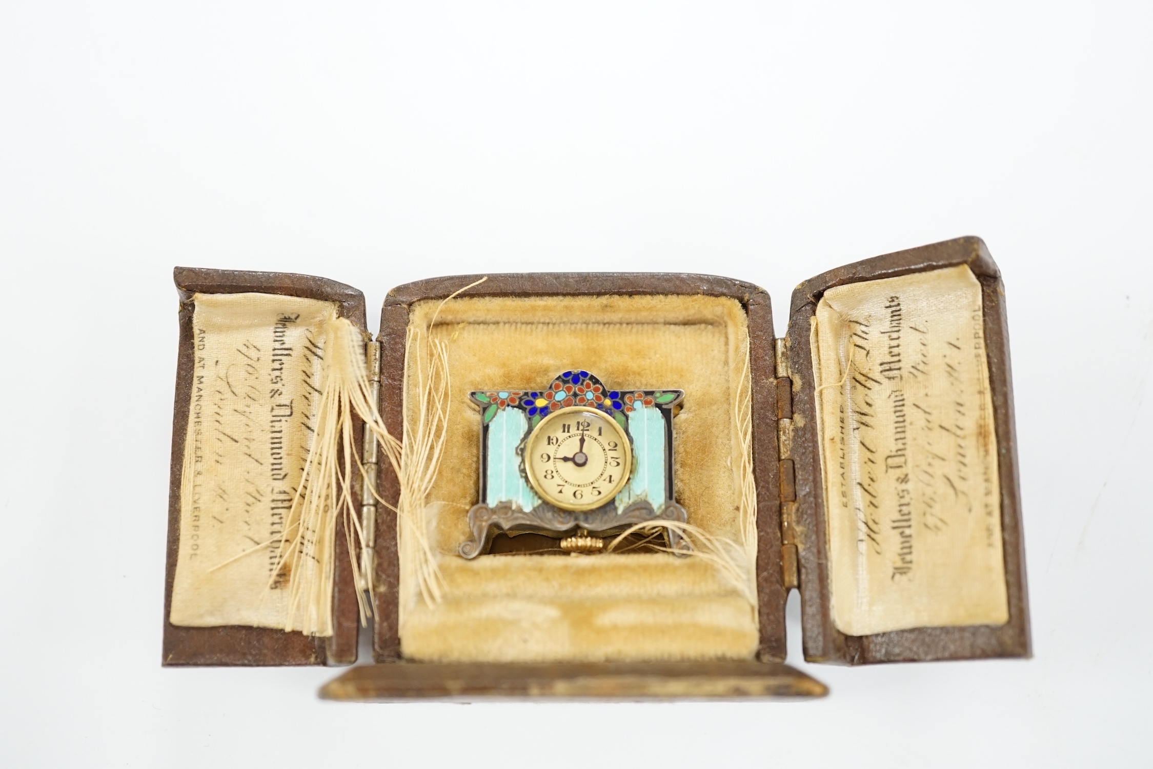 A miniature enamel timepiece modelled as a mantle clock, with watch movement, 2cm high, in fitted - Image 5 of 5