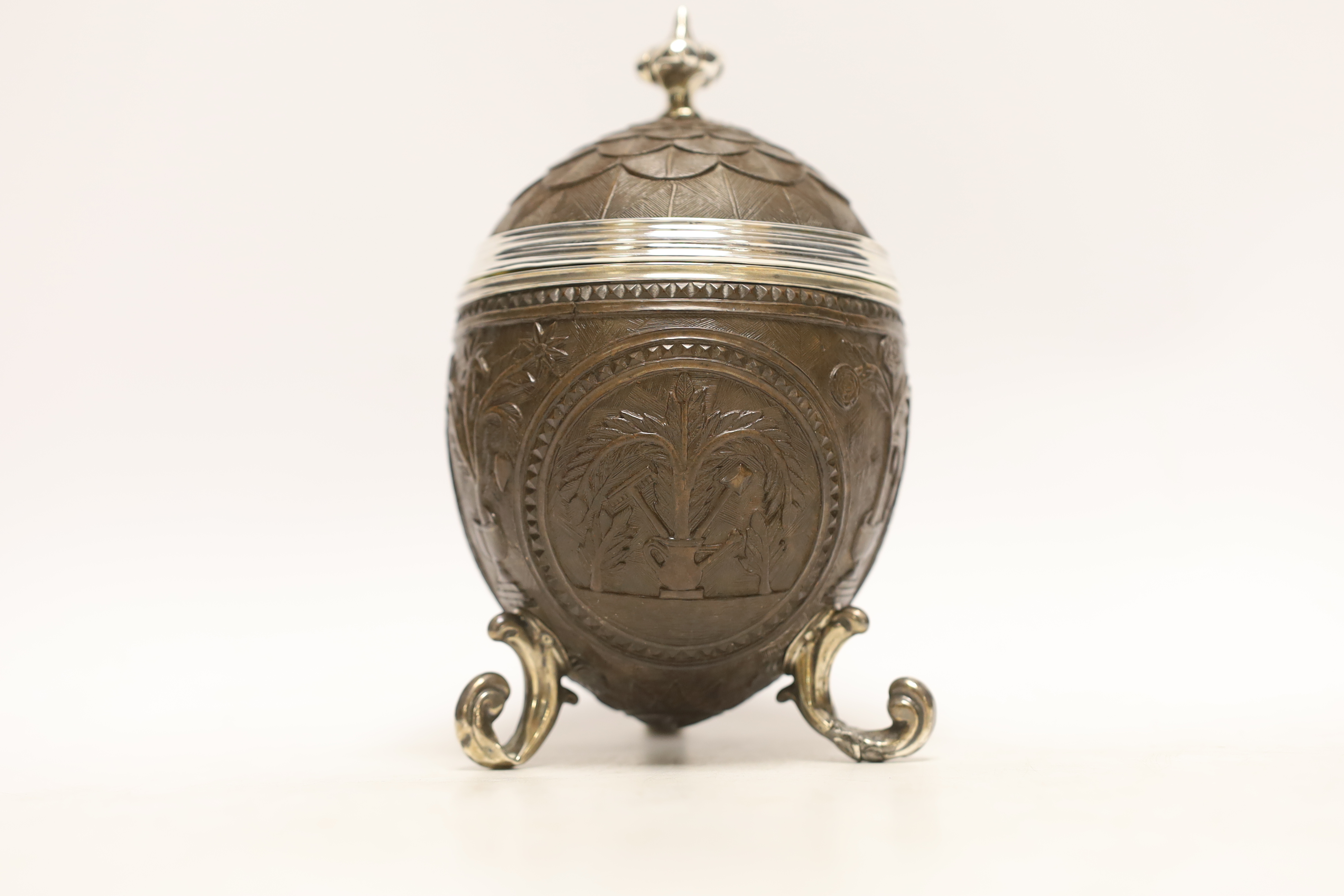 A unmarked white metal mounted coconut cup, on three scroll feet, height 17.4cm. - Image 2 of 3