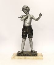 A spelter figure of a boy with bird on two step marble base, 39.5cm high