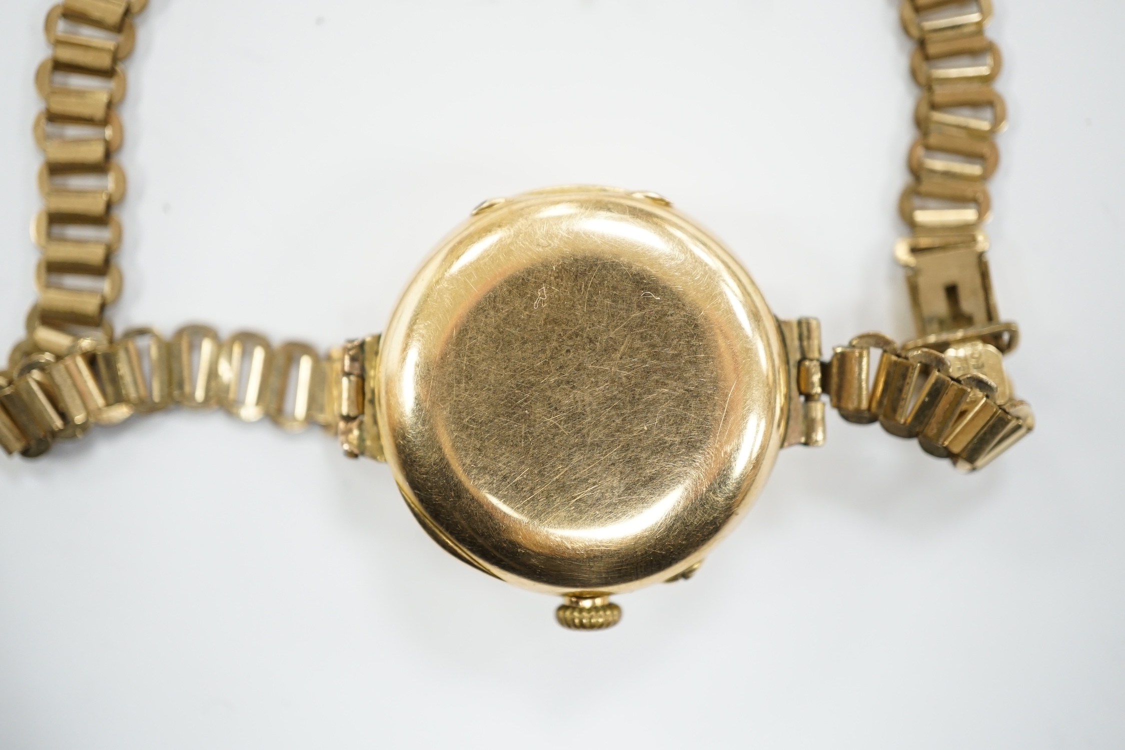 An early 20th century 15ct gold manual wind wrist watch, on a rolled gold bracelet. - Image 4 of 4